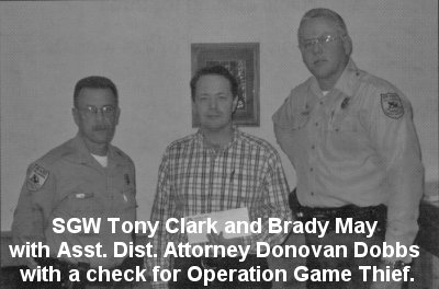 SGW Tony Clark and Brady May with Asst. Dist. Attorney Donovan Dobbs with a check for Operation Game Thief.